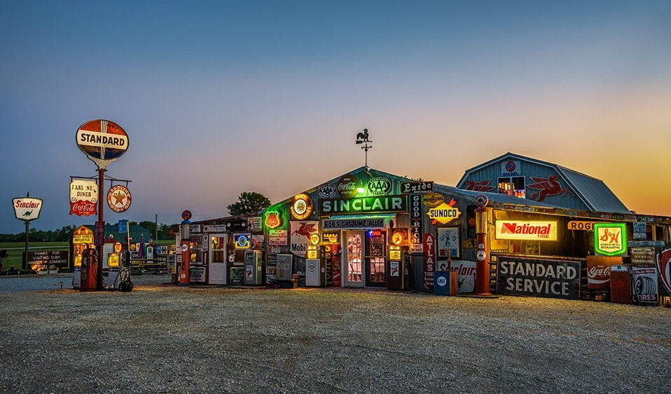 An old gas station at sunset.