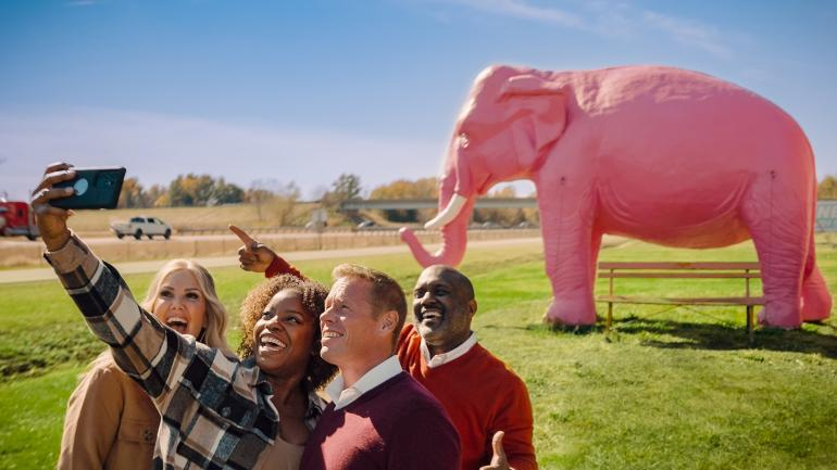 Snapping a selfie in front of a life-size hot pink elephant at Pink Elephant Antique Mall in Livingston
