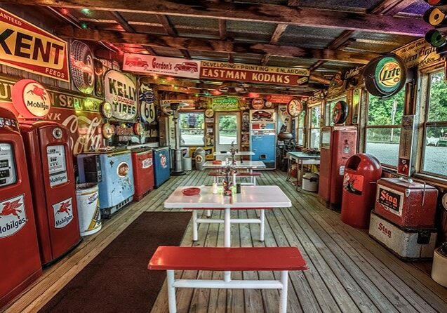 An old fashioned gas station with lots of old signs located on Route 66 in Missouri.